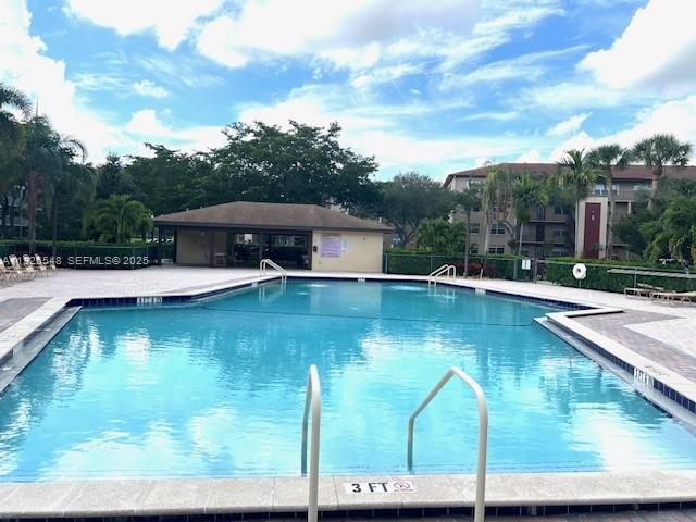 13455 Southwest 9th Court, Unit 216J Pembroke Pines, FL 33027 - Photo 41 of 66 a view of a lake with a patio