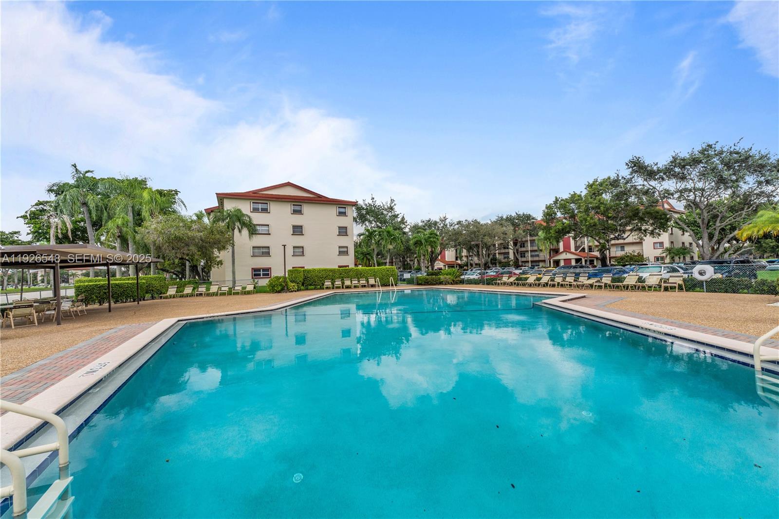 13455 Southwest 9th Court, Unit 216J Pembroke Pines, FL 33027 - Photo 44 of 66 a view of swimming pool with outdoor seating and deck
