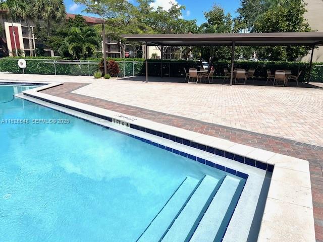 13455 Southwest 9th Court, Unit 216J Pembroke Pines, FL 33027 - Photo 45 of 66 a view of swimming pool from a balcony
