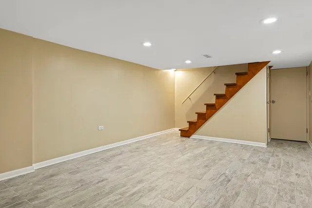 a view of an empty room with stairs