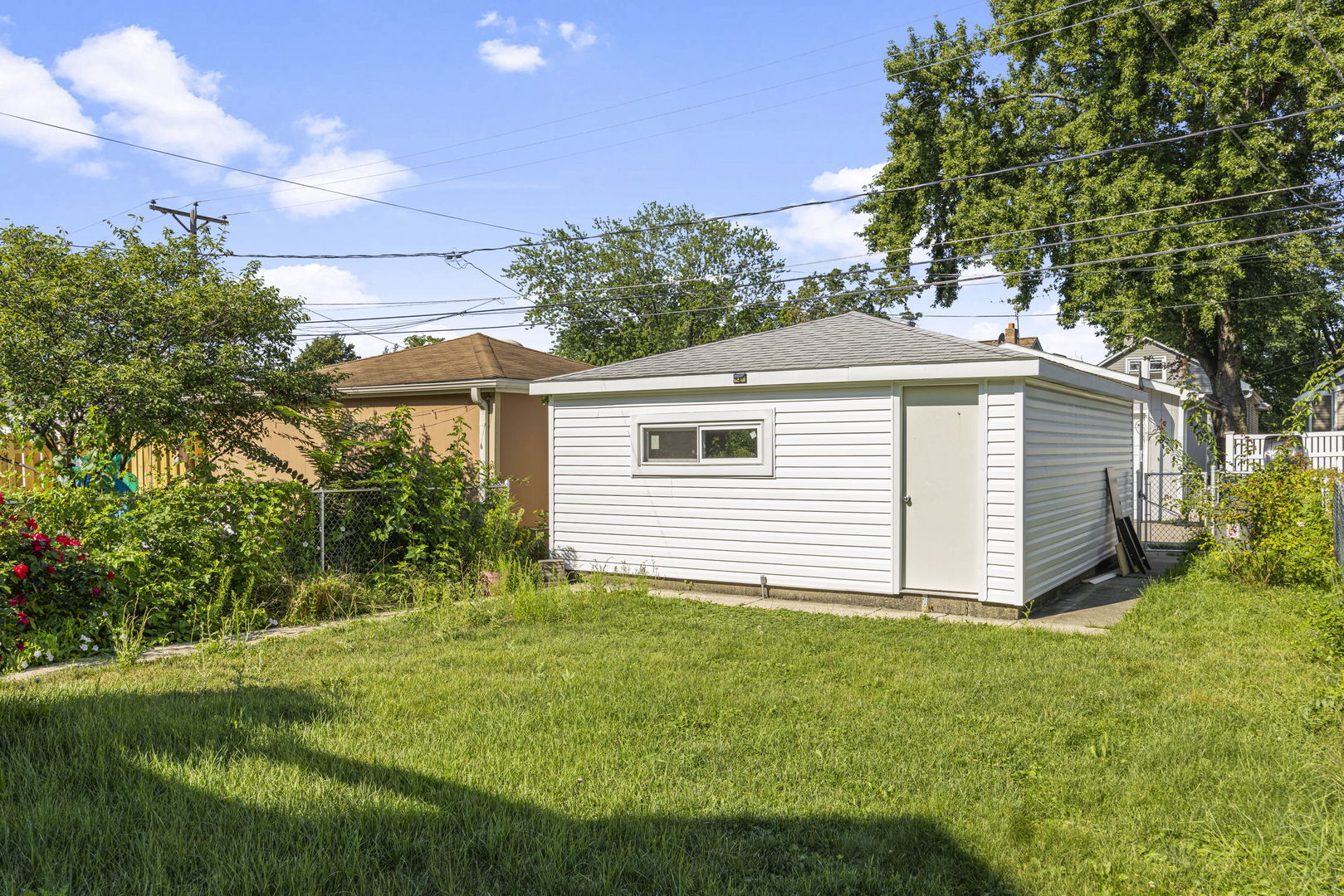 4236 North Ozark Avenue Norridge, IL 60706 - Photo 17 of 17 a view of a house with a yard and a garden