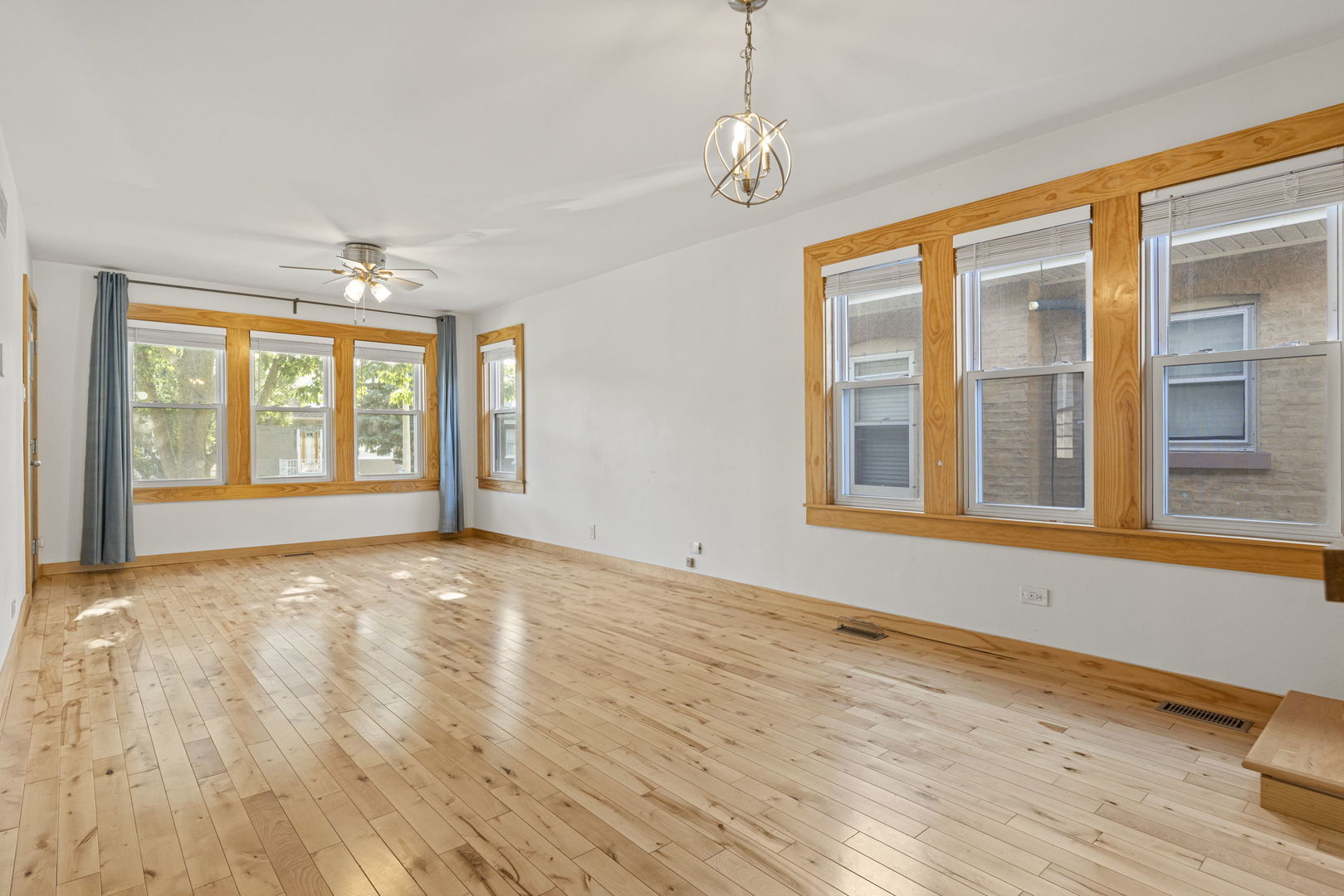 4236 North Ozark Avenue Norridge, IL 60706 - Photo 2 of 17 a view of an empty room with wooden floor and a window