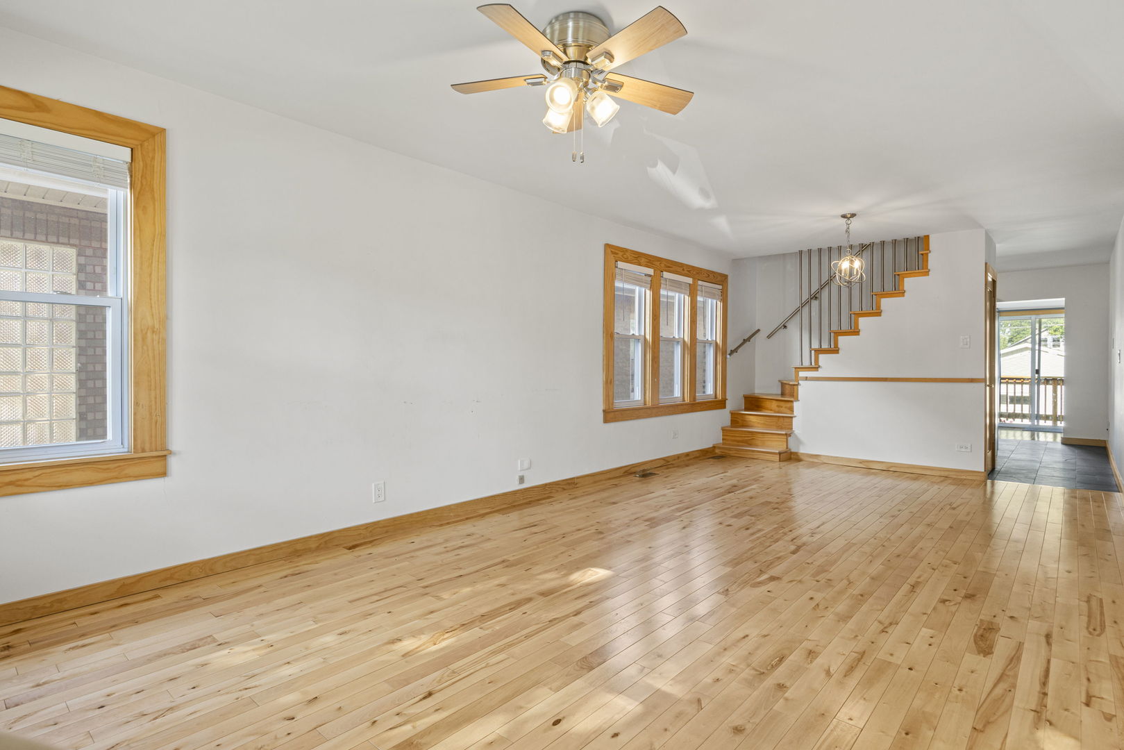 4236 North Ozark Avenue Norridge, IL 60706 - Photo 3 of 17 a view of empty room with wooden floor and fan