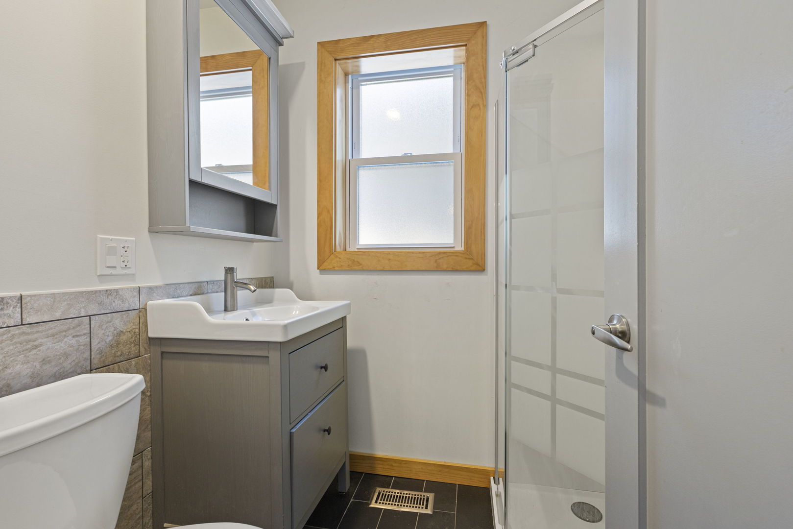 4236 North Ozark Avenue Norridge, IL 60706 - Photo 6 of 17 a bathroom with a sink toilet and shower