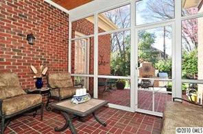 2018 Harris Road Charlotte, NC 28211 - Photo 14 of 16 a living room with furniture and a floor to ceiling window