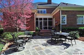 2018 Harris Road Charlotte, NC 28211 - Photo 15 of 16 a front view of a house with sitting area and garden