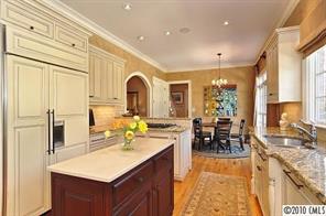 2018 Harris Road Charlotte, NC 28211 - Photo 7 of 16 a view of living room with granite countertop furniture and fireplace