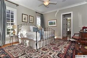 2018 Harris Road Charlotte, NC 28211 - Photo 8 of 16 a bed room with a bed and a window