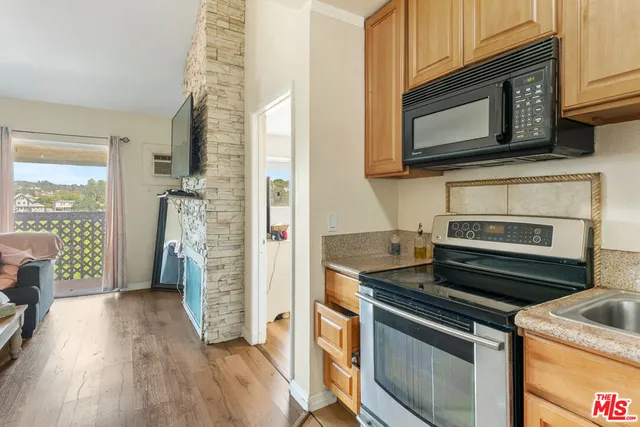 a kitchen with a stove and a microwave
