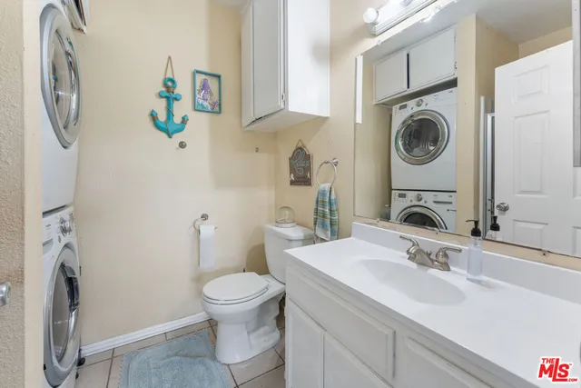 a bathroom with a sink toilet and a mirror