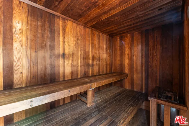 a sitting area with wooden walls