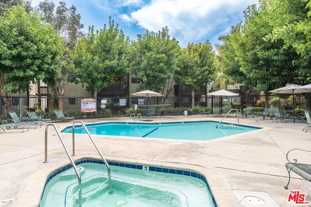 a view of a swimming pool with a patio