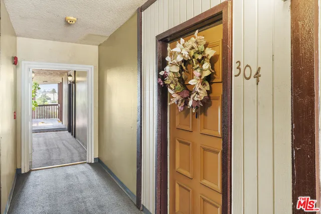a view of a hallway and interior of the house