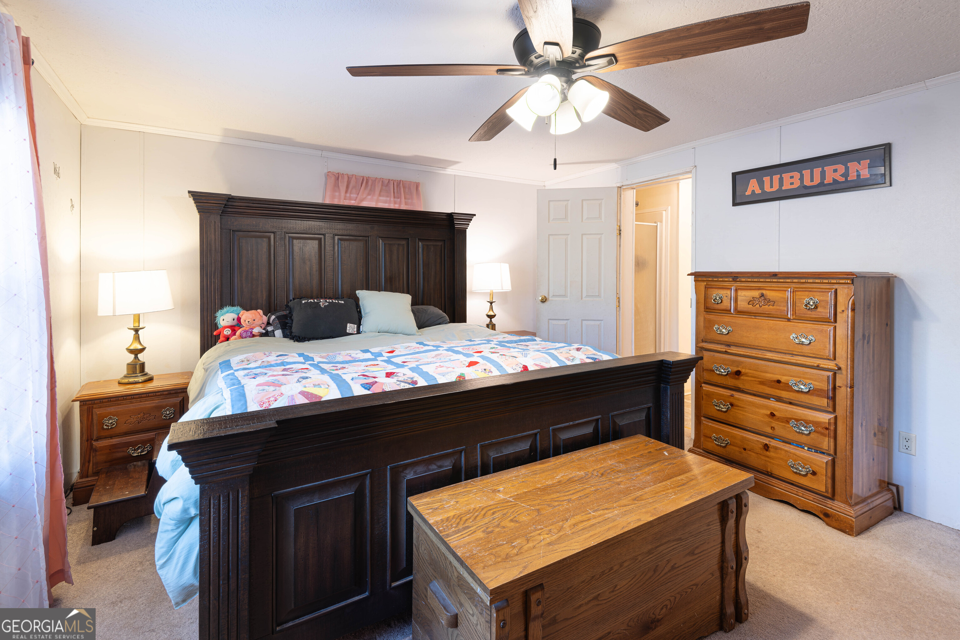 161 Cherokee Trail Forsyth, GA 31029 - Photo 14 of 32 a room with a bed and a dresser