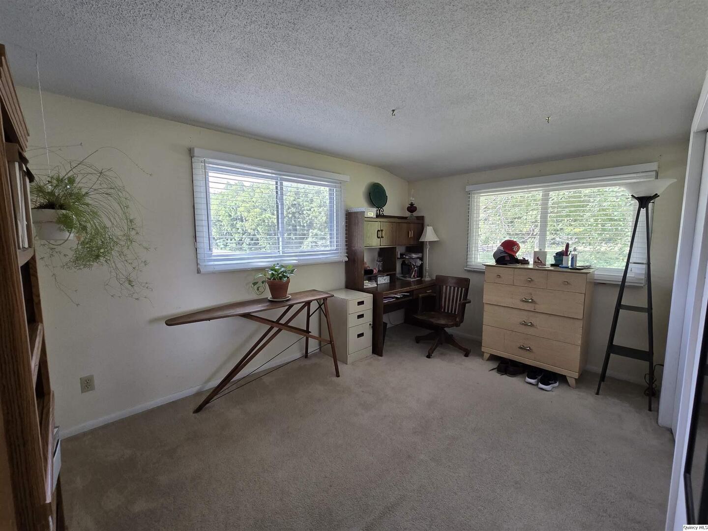 7955 Sugar Grove Road Rushville, IL 62681 - Photo 18 of 26 a view of a workspace with furniture and a window