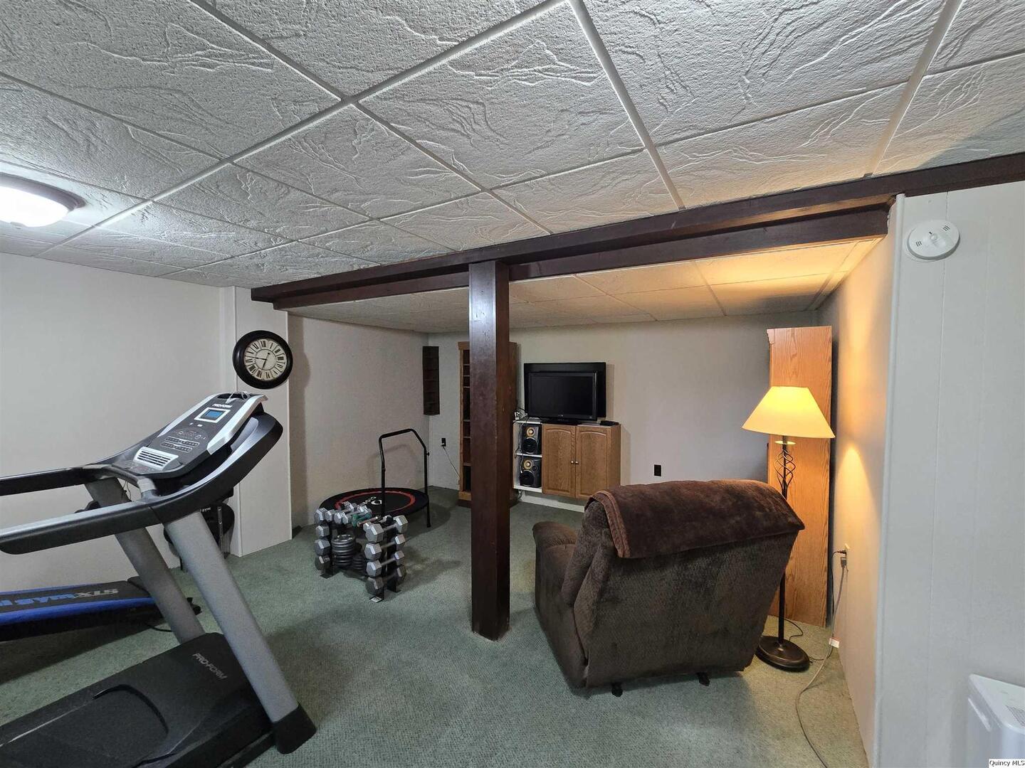 7955 Sugar Grove Road Rushville, IL 62681 - Photo 22 of 26 a living room with furniture and a chandelier