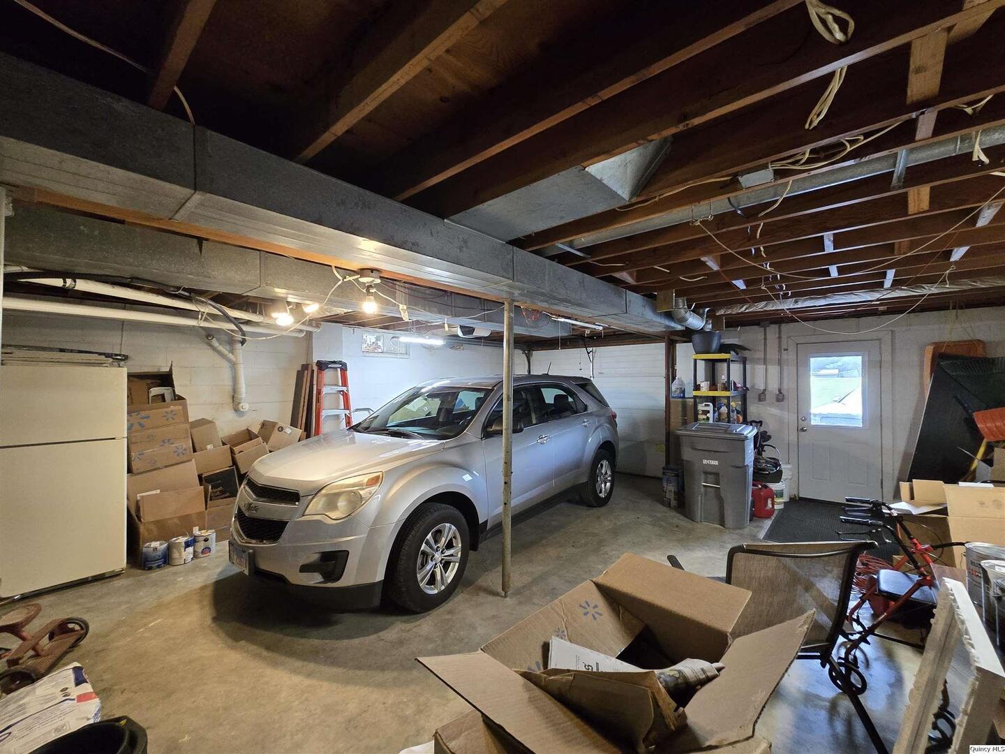 7955 Sugar Grove Road Rushville, IL 62681 - Photo 25 of 26 a car and car parked in a garage