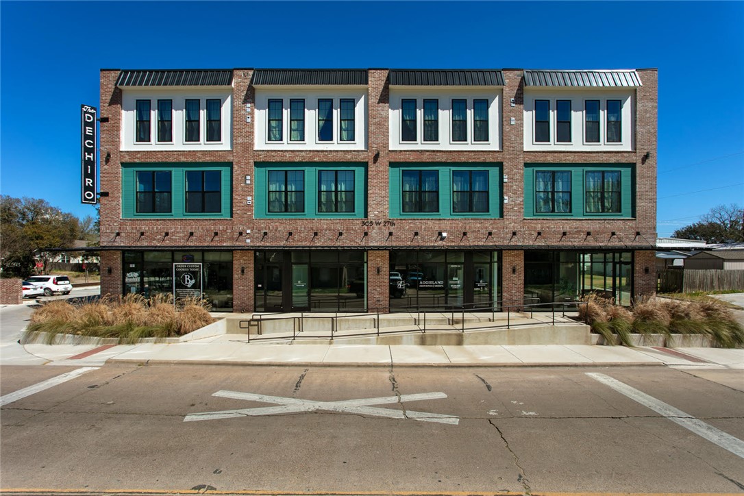 a view of a building with a street