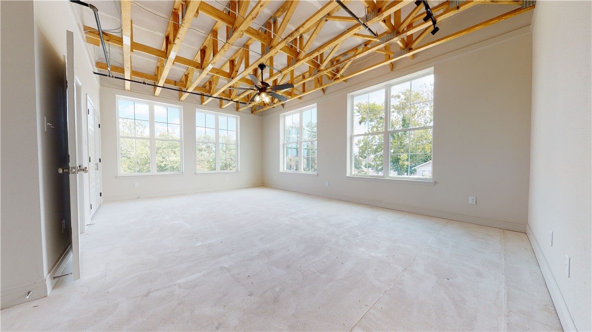 305 West 27th Street, Unit 228 Bryan, TX 77803 - Photo 10 of 17 an empty room with windows and entrance