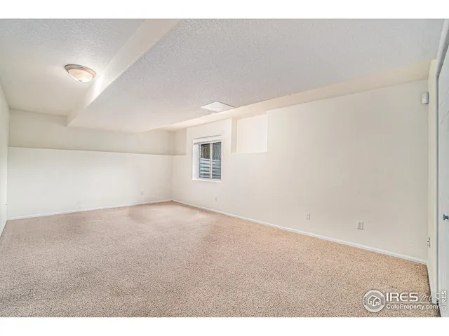 a view of an empty room and a window