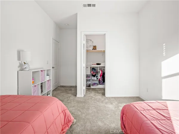 a bedroom with a bed and a cabinets