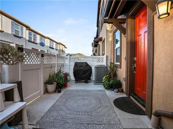 a view of front door and potted plants
