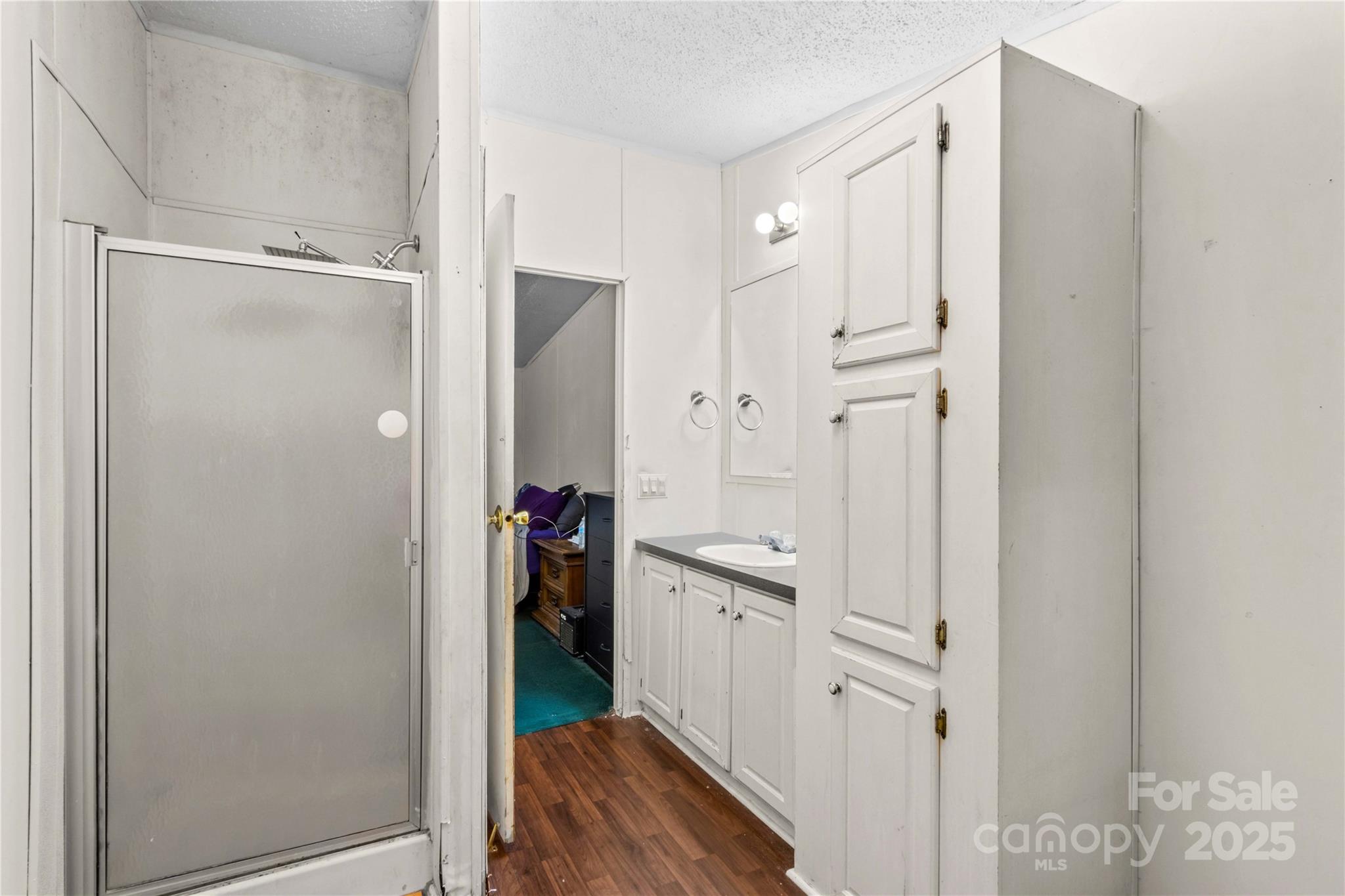 160 Ranchway Mocksville, NC 27028 - Photo 13 of 24 a view of a kitchen with refrigerator and wooden floor