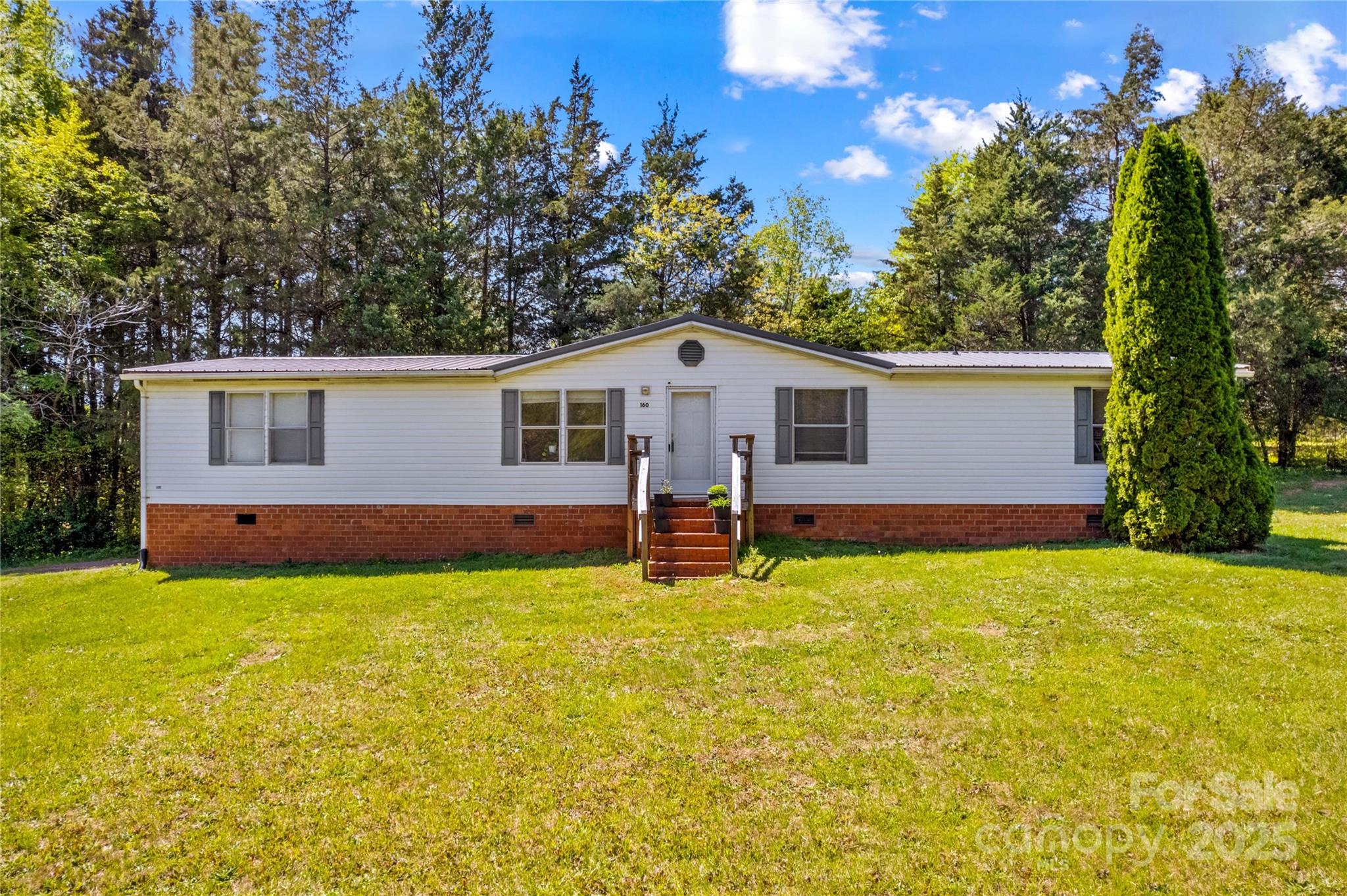 160 Ranchway Mocksville, NC 27028 - Photo 24 of 24 a view of a house with a yard and a tree