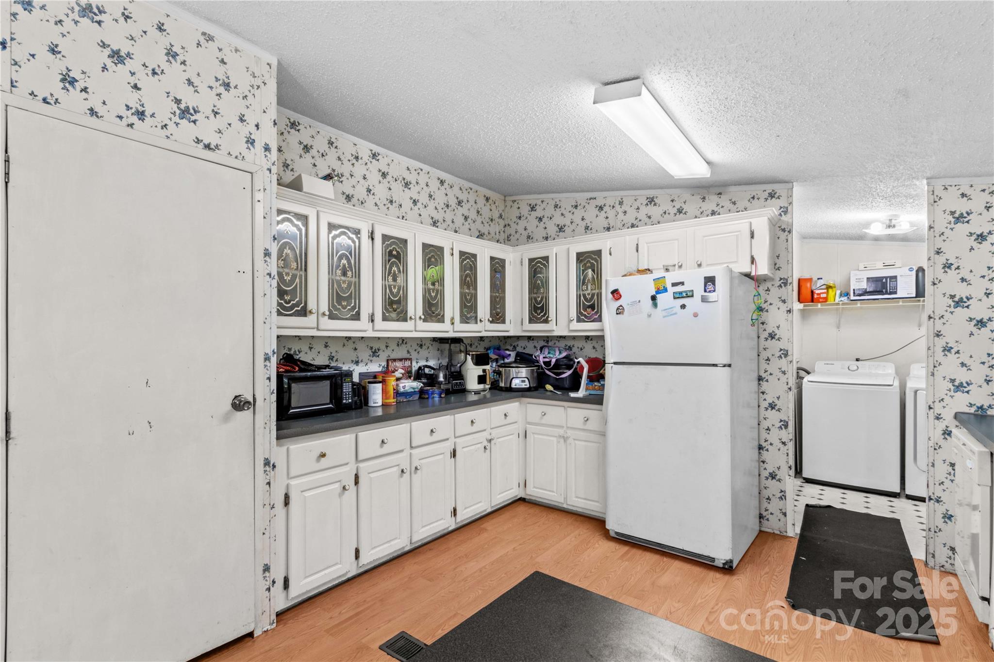 160 Ranchway Mocksville, NC 27028 - Photo 5 of 24 a kitchen with refrigerator and cabinets