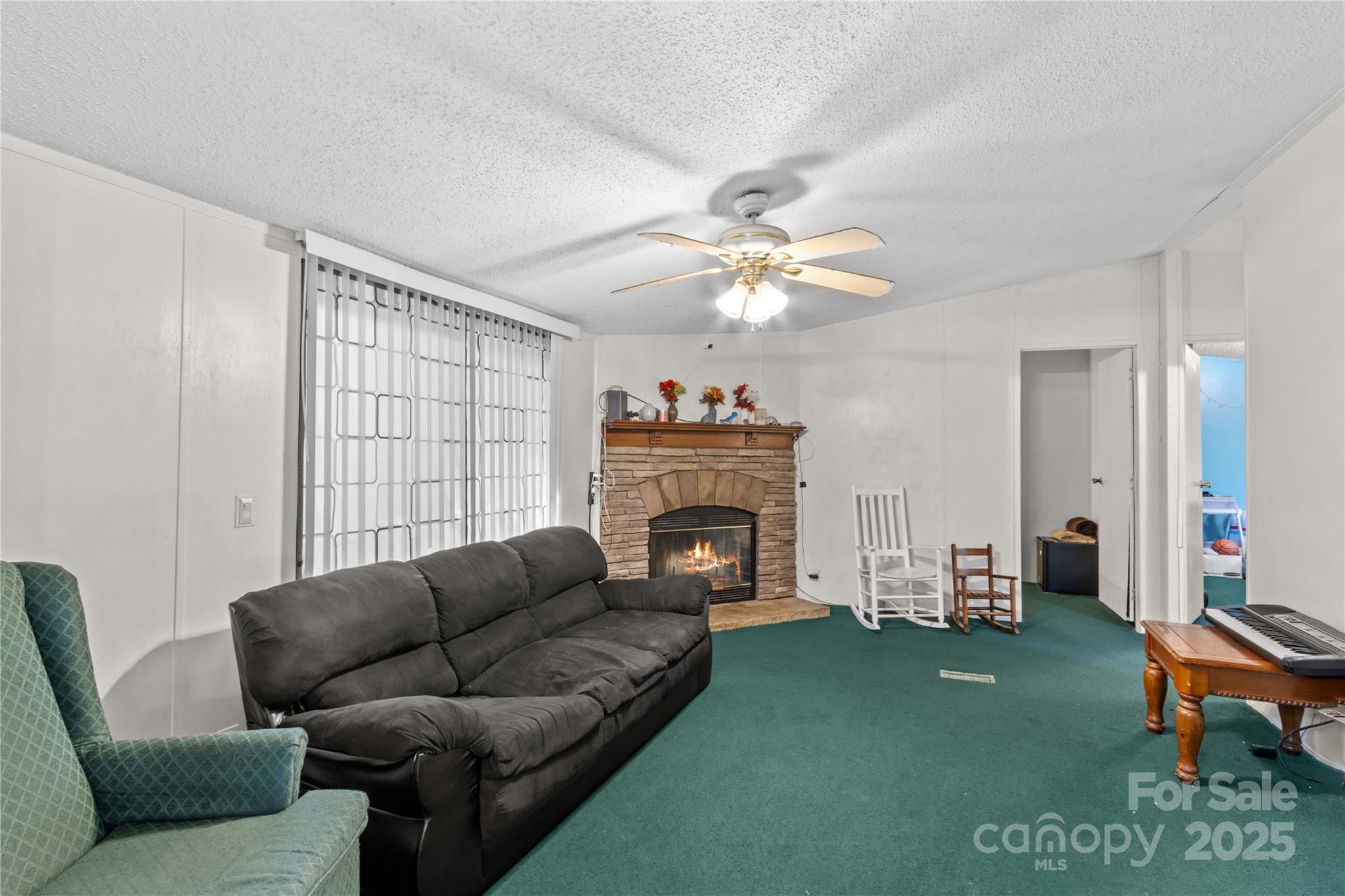 160 Ranchway Mocksville, NC 27028 - Photo 9 of 24 a living room with furniture and a fireplace