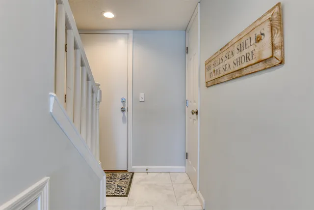 a view of a hallway with staircase