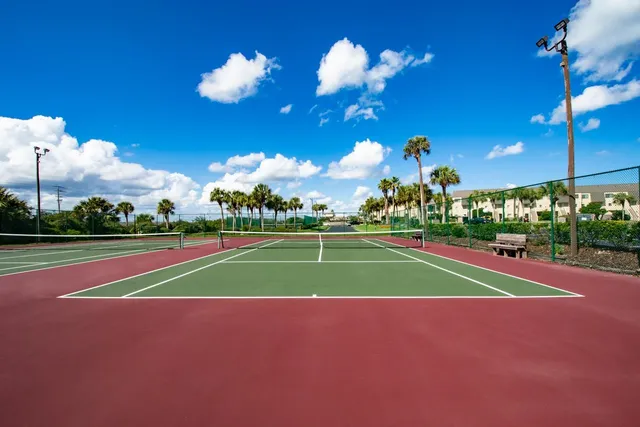 a view of a swimming pool with outdoor seating