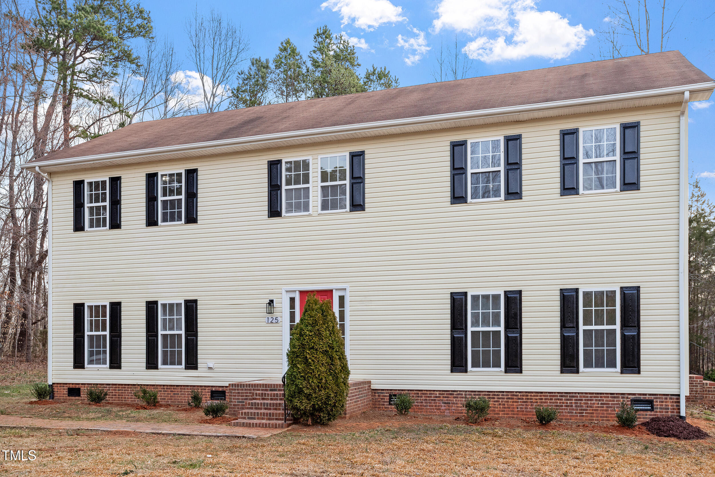 125 Vance Wrenn Road Roxboro, NC 27573 - Photo 33 of 39 a front view of a house with a garden