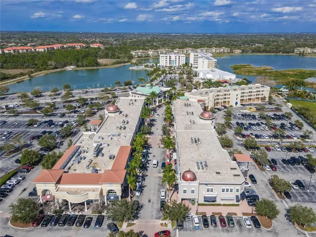 an outdoor space with swimming pool and tennis court