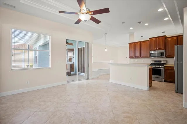 a view of kitchen with stainless steel appliances refrigerator and microwave