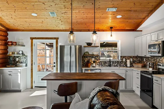 a very nice looking kitchen with a large window