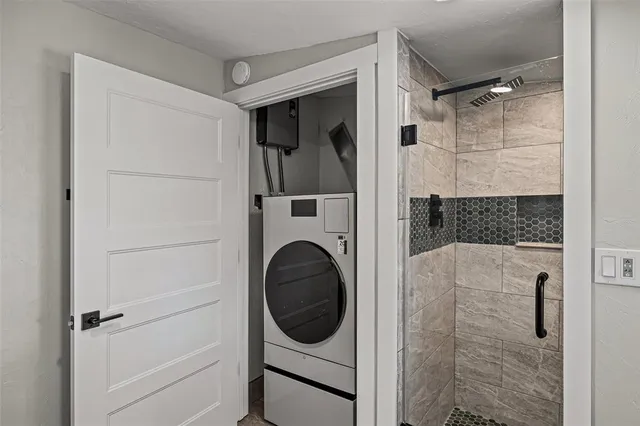 a bathroom with a bathtub and a shower