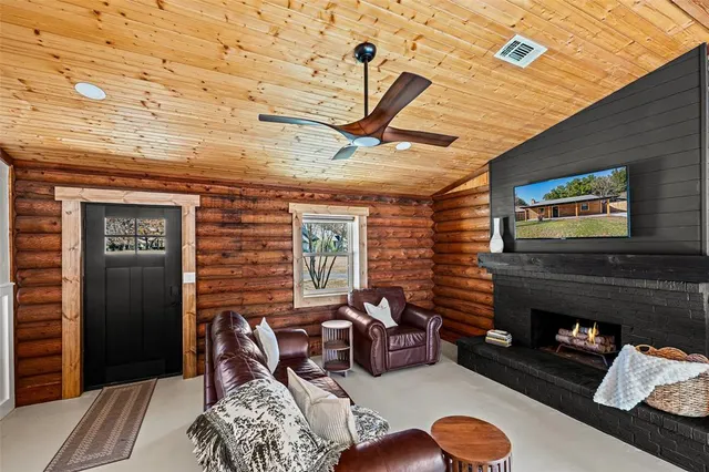 a bedroom with furniture and a fireplace