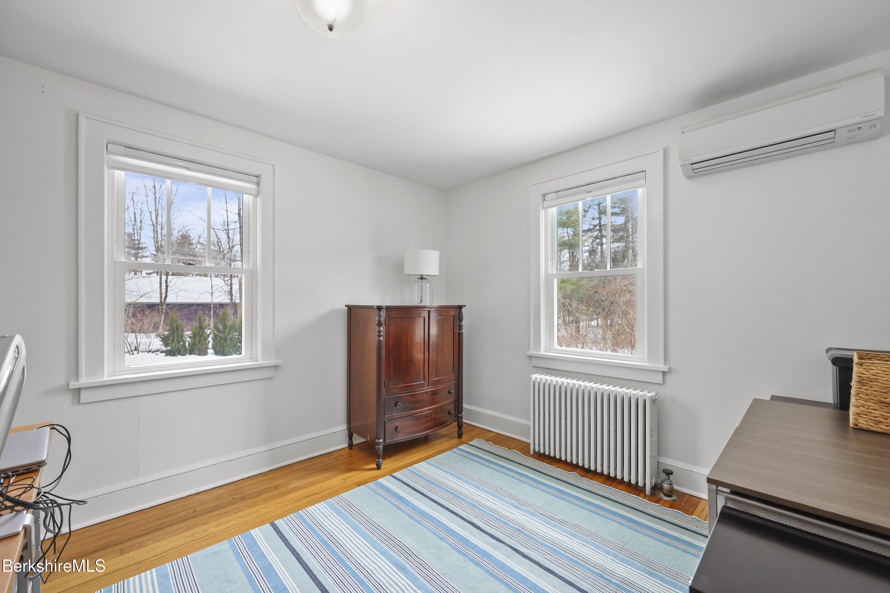 8 Lukeman Lane Stockbridge, MA 01229 - Photo 11 of 24 a view of an empty room with a window and wooden floor