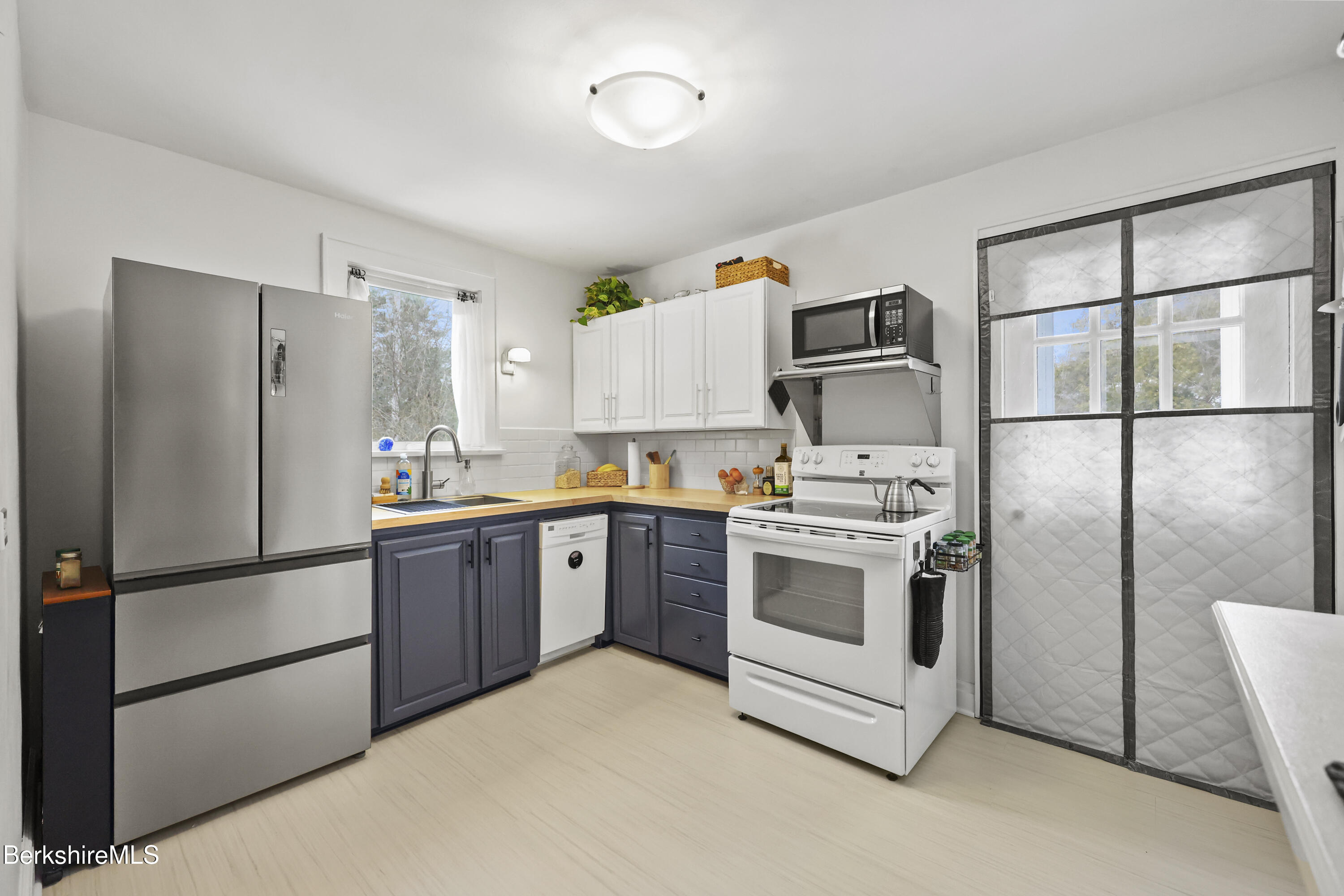 8 Lukeman Lane Stockbridge, MA 01229 - Photo 8 of 24 a kitchen with a refrigerator stove and microwave