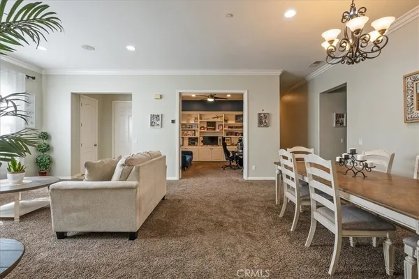 a living room with furniture and a dining room