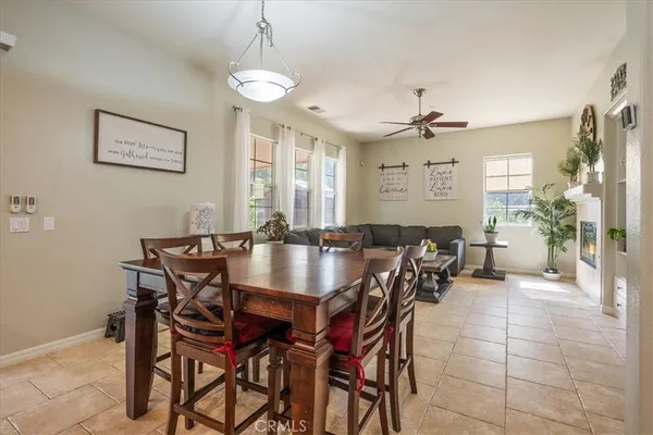 a view of a a dining room with furniture and a chandelier