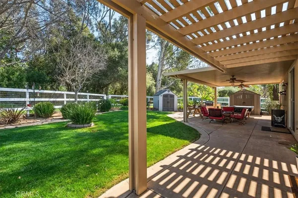 a view of a backyard with sitting area