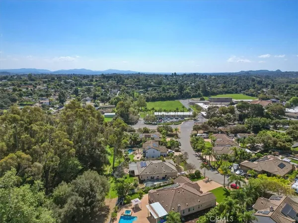 an aerial view of a house with mountain view