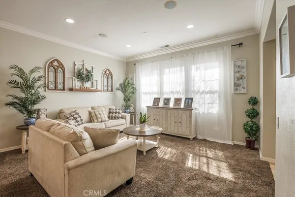 a living room with furniture and window