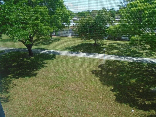 a front view of a house with swimming pool having outdoor seating