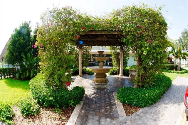 a buildings with car parked in front of it