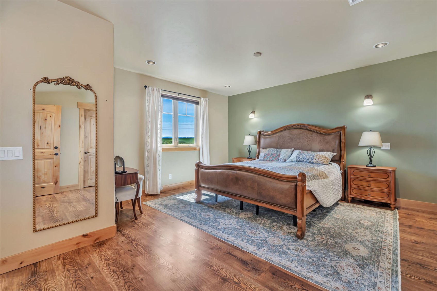 938 South Dry Creek Road Hayden, CO 81639 - Photo 25 of 34 a bedroom with a bed and wooden floor