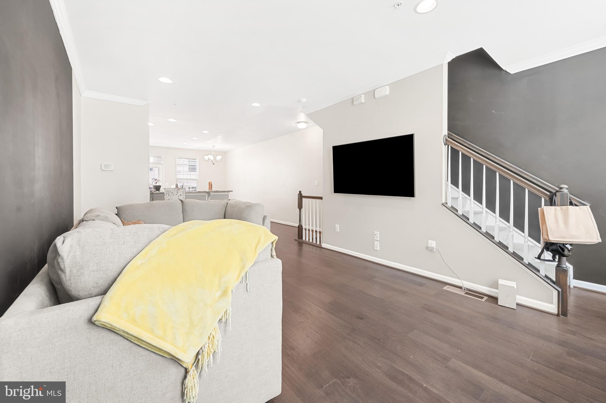 810 South Macon Street Baltimore, MD 21224 - Photo 12 of 31 a living room with a couch and a flat screen tv