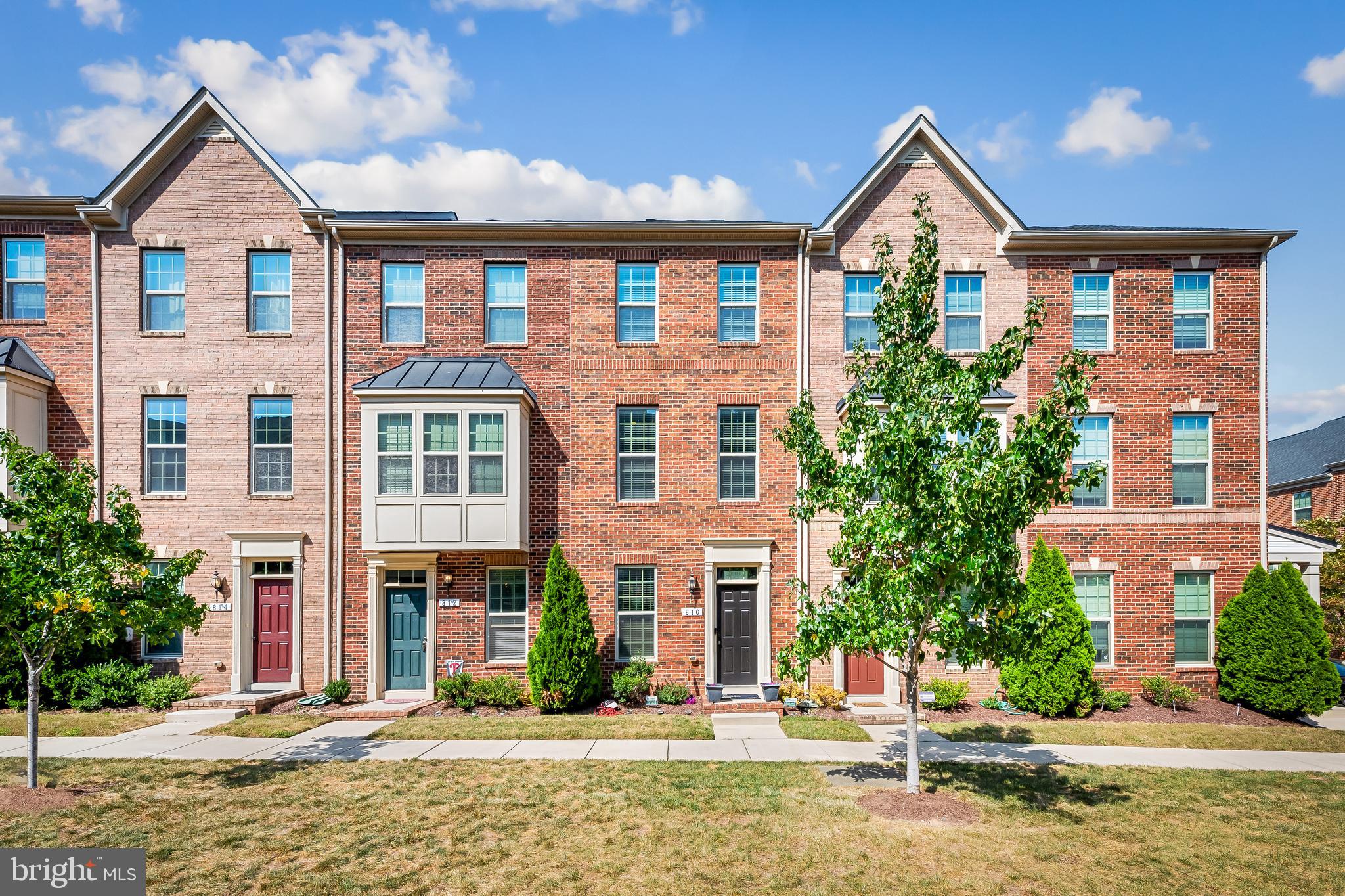 810 South Macon Street Baltimore, MD 21224 - Photo 3 of 31 a front view of a residential apartment building with a yard